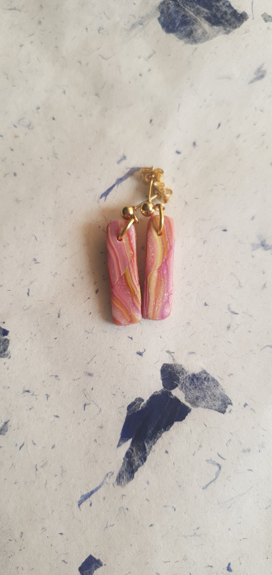 Boucles d’oreilles dominante rose longues