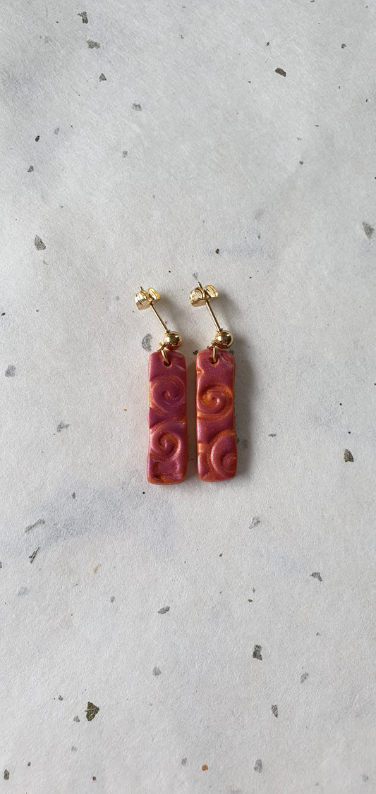 Boucles d’oreilles longues orange motif arrondi